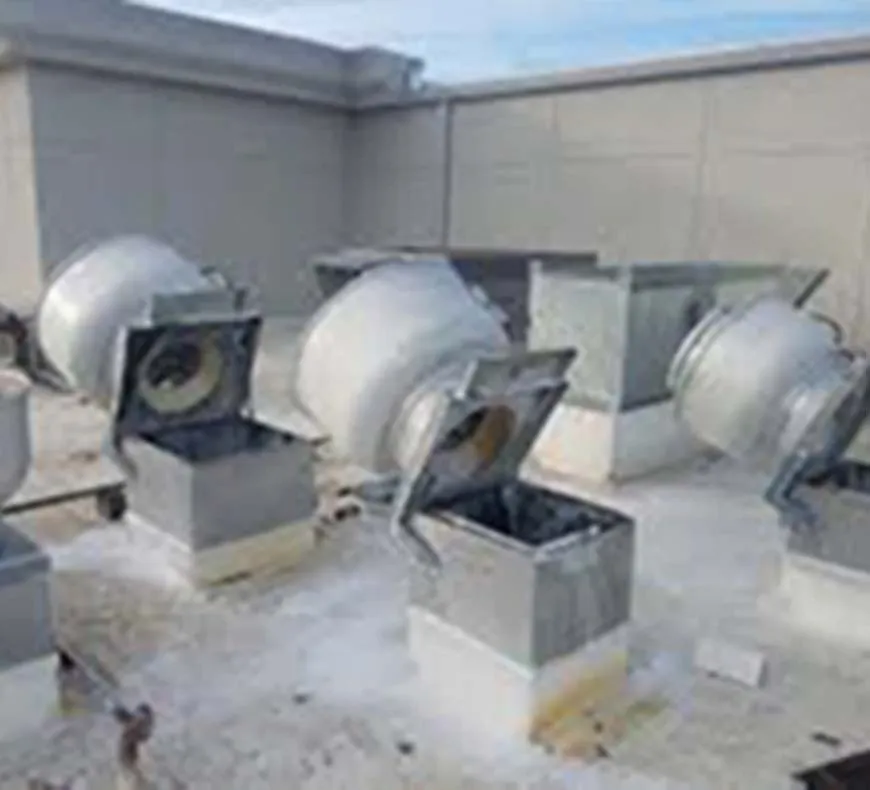 Technician installing exhaust fan hinge kit
